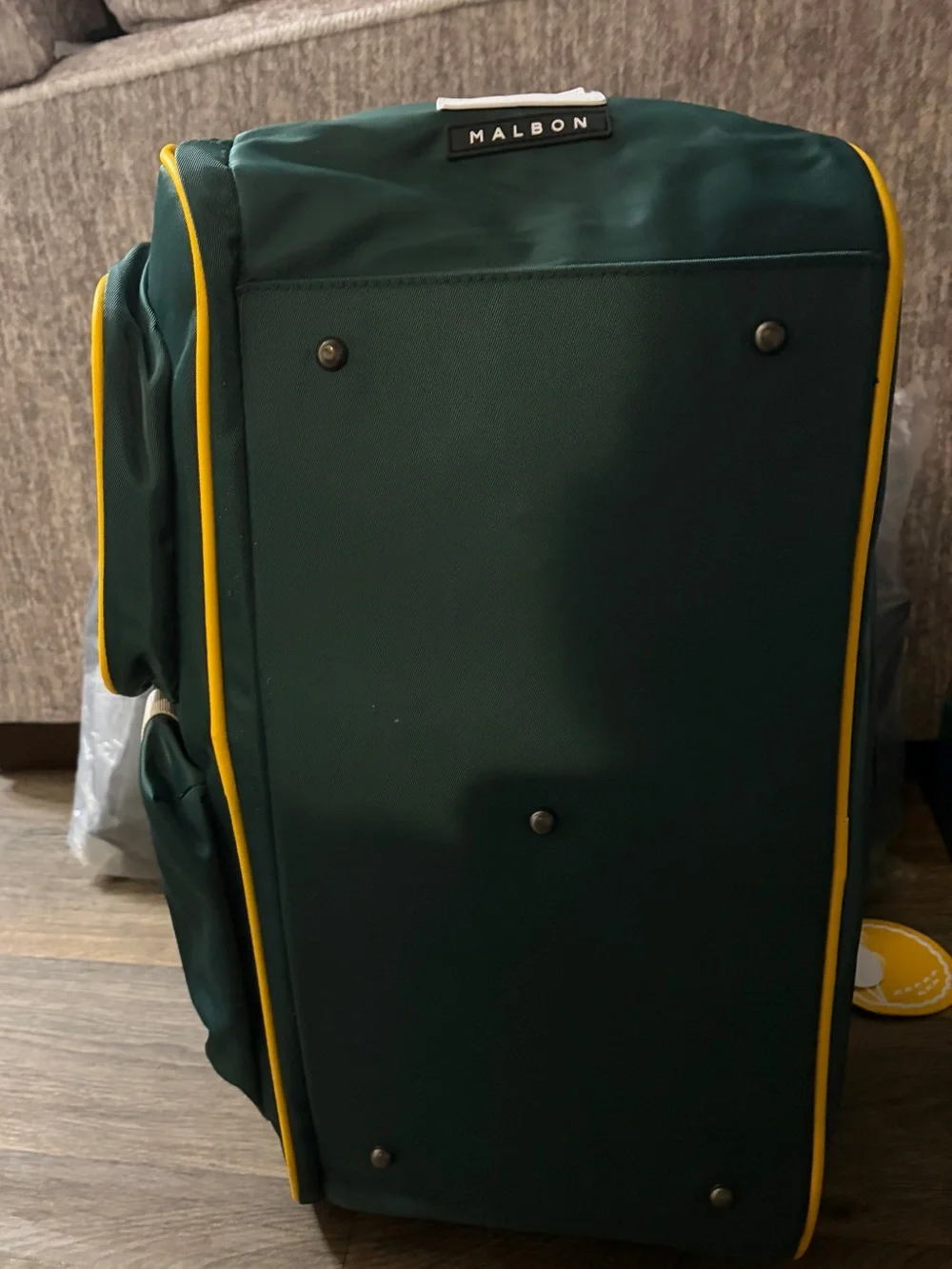 MALBON Green and gold duffel/weekender travel bag.